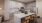 a kitchen with a table and chairs