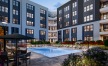 Courtyard with pool with the apartment building in the foreground